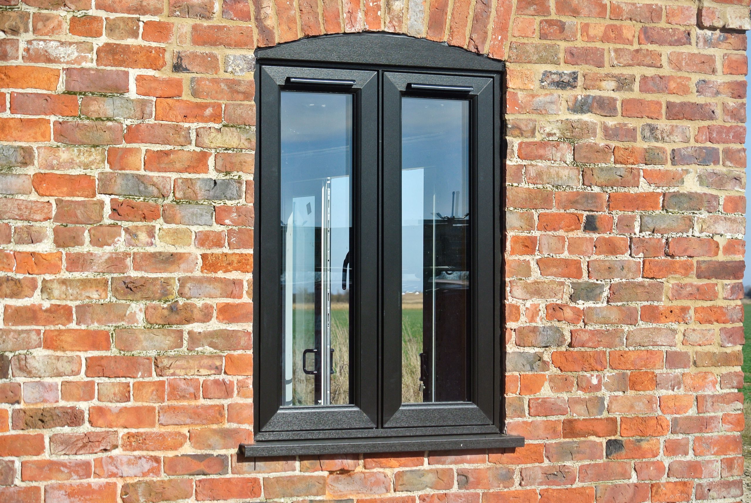 Barn Conversion with Black Flush Casement Windows and Patio Doors