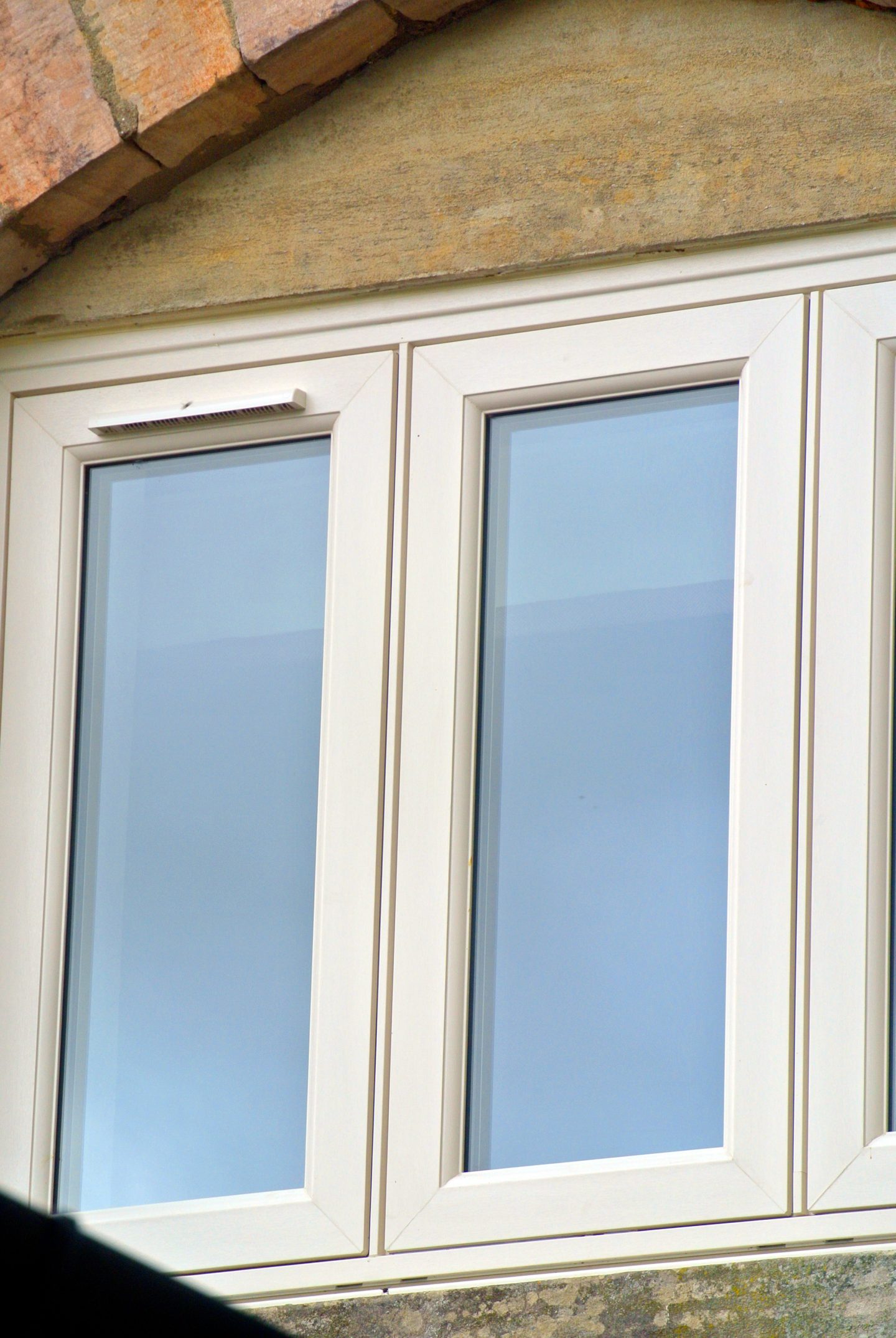 Cream three pane flush casement window