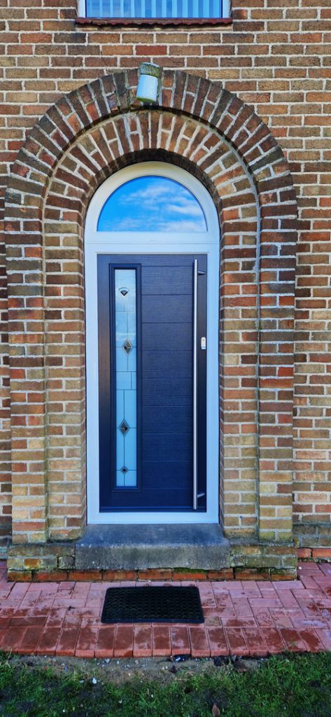 Composite front door replacement with arched toplight