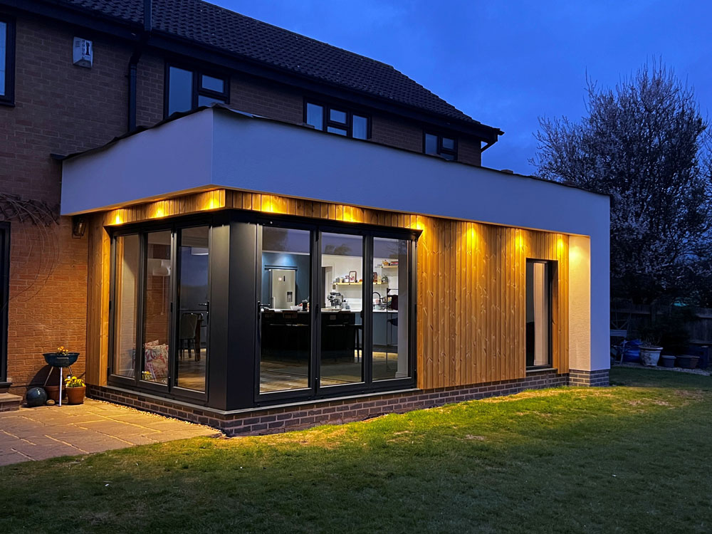 nightime home extension with bifold doors